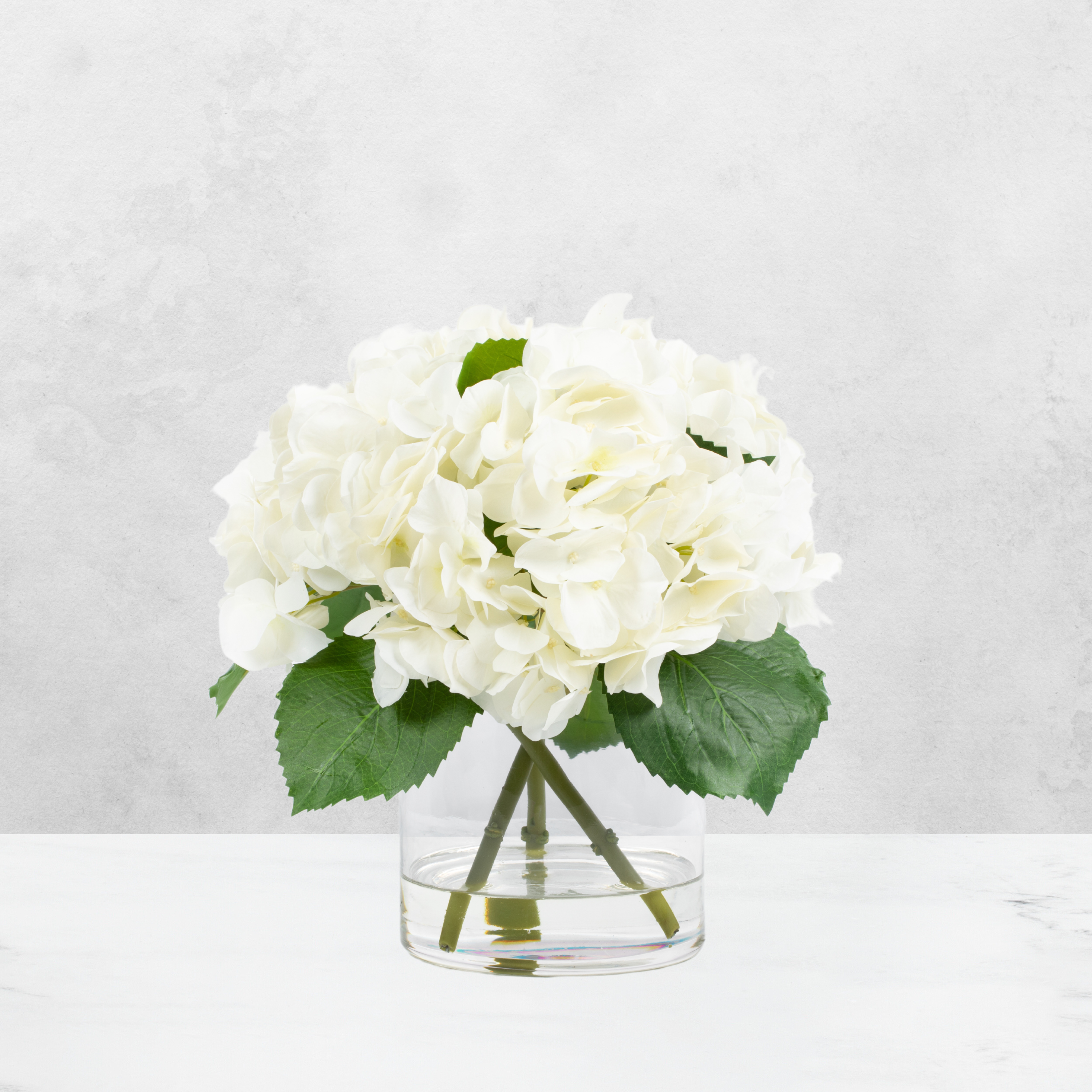 Faux hydrangea centerpiece arrangement in glass vase-2