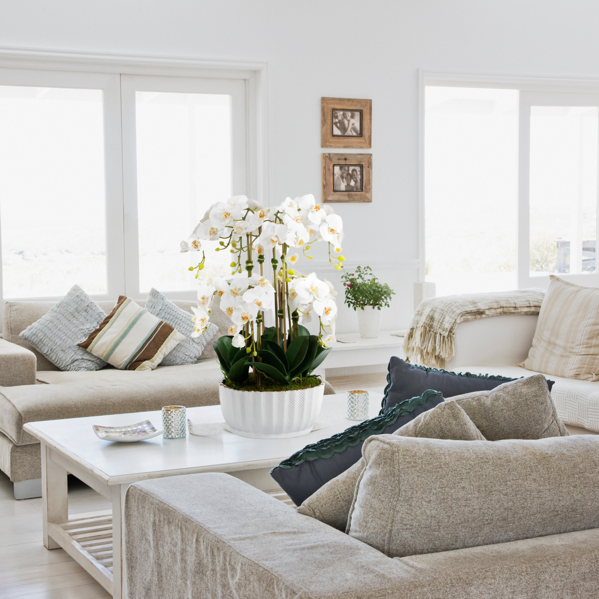 Faux orchid centerpiece in white vase