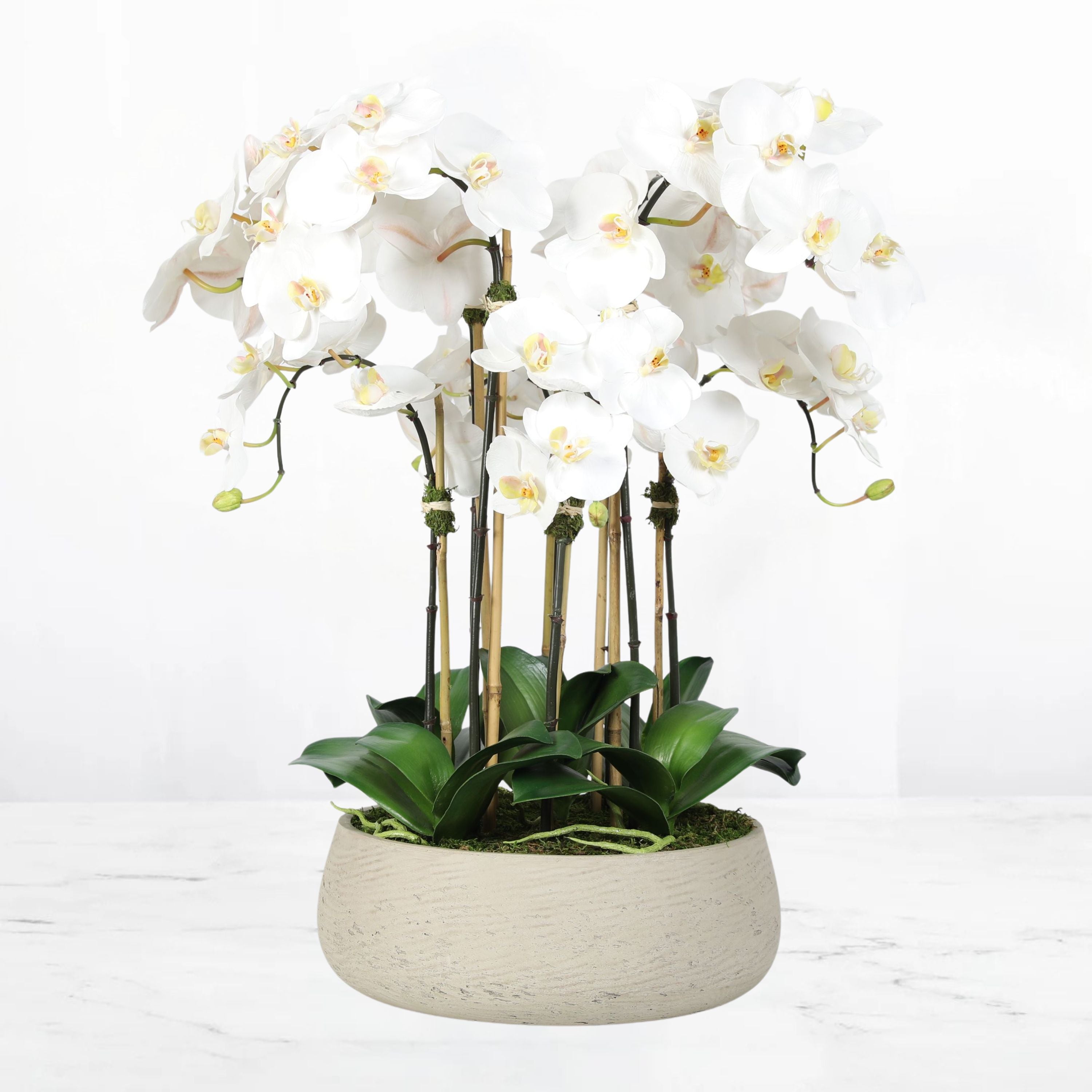 Artificial orchid centerpiece arrangement in beige planter - 28"