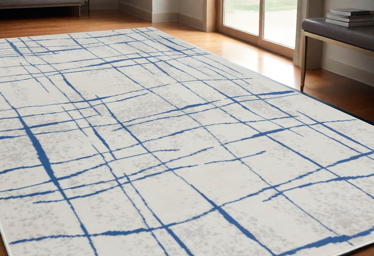 5' X 7' Blue And Ivory Abstract Dhurrie Area Rug-0