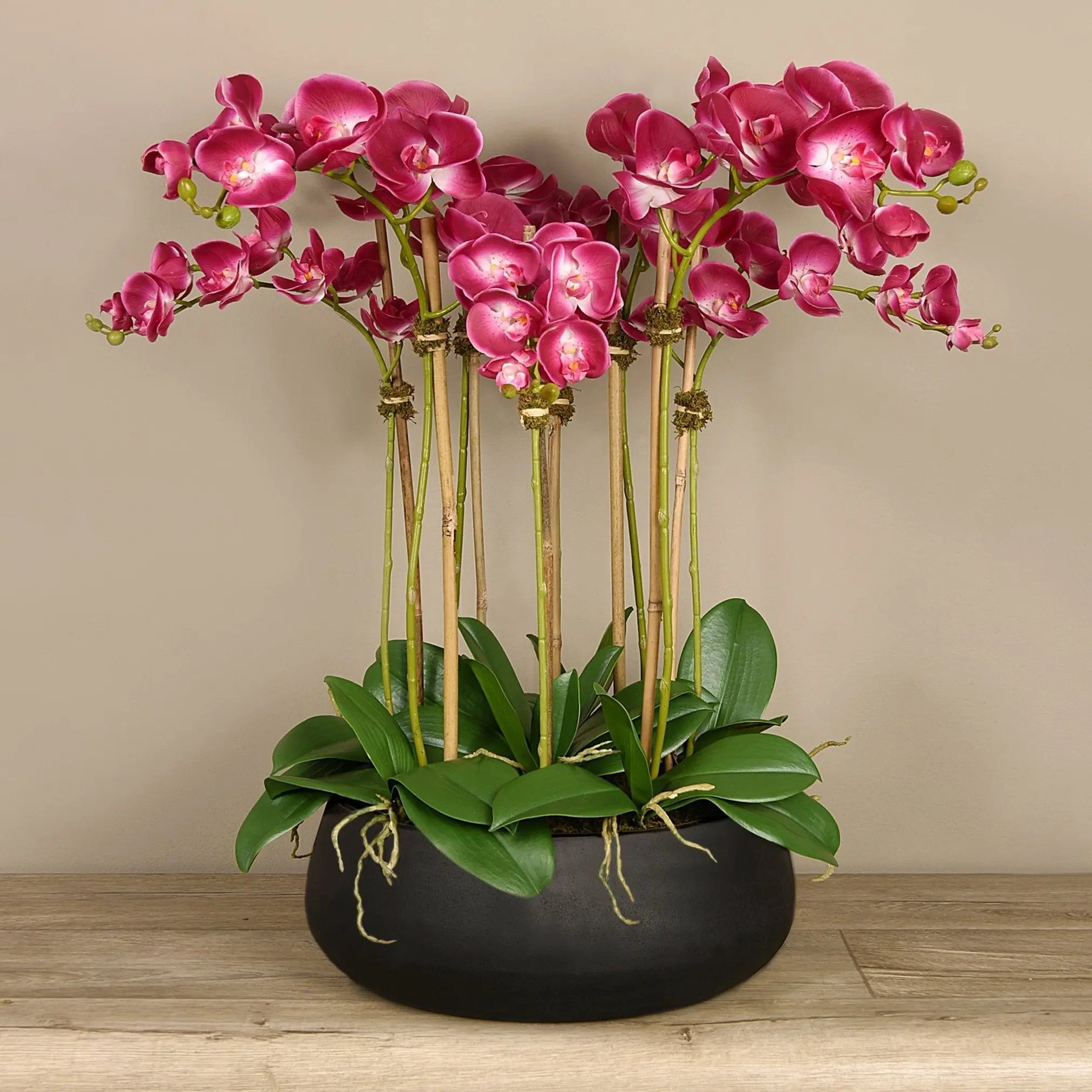 Artificial floral arrangement centerpiece with pink orchids in black planter-0