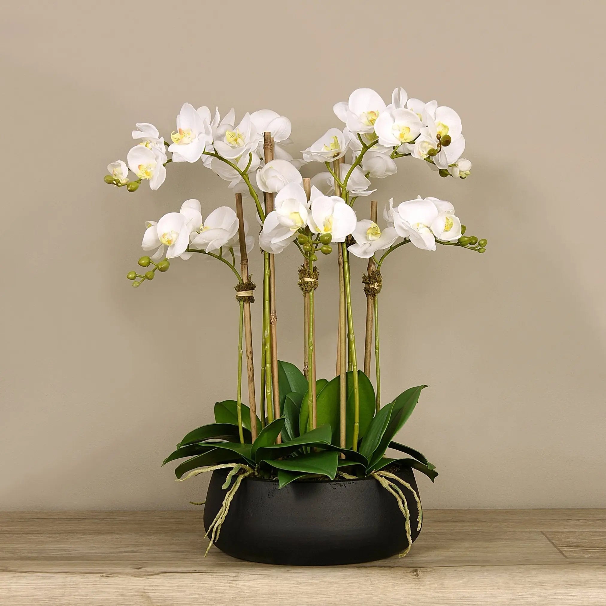 Faux white orchid arrangement in matte black planter-1