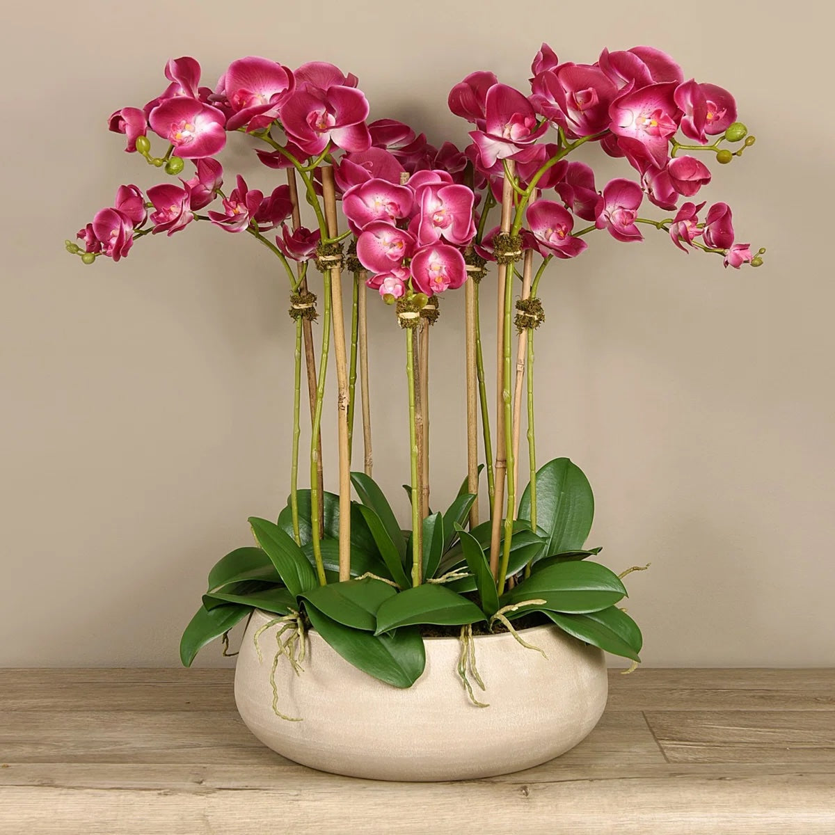 Artificial pink orchid centerpiece arrangement in beige planter-0