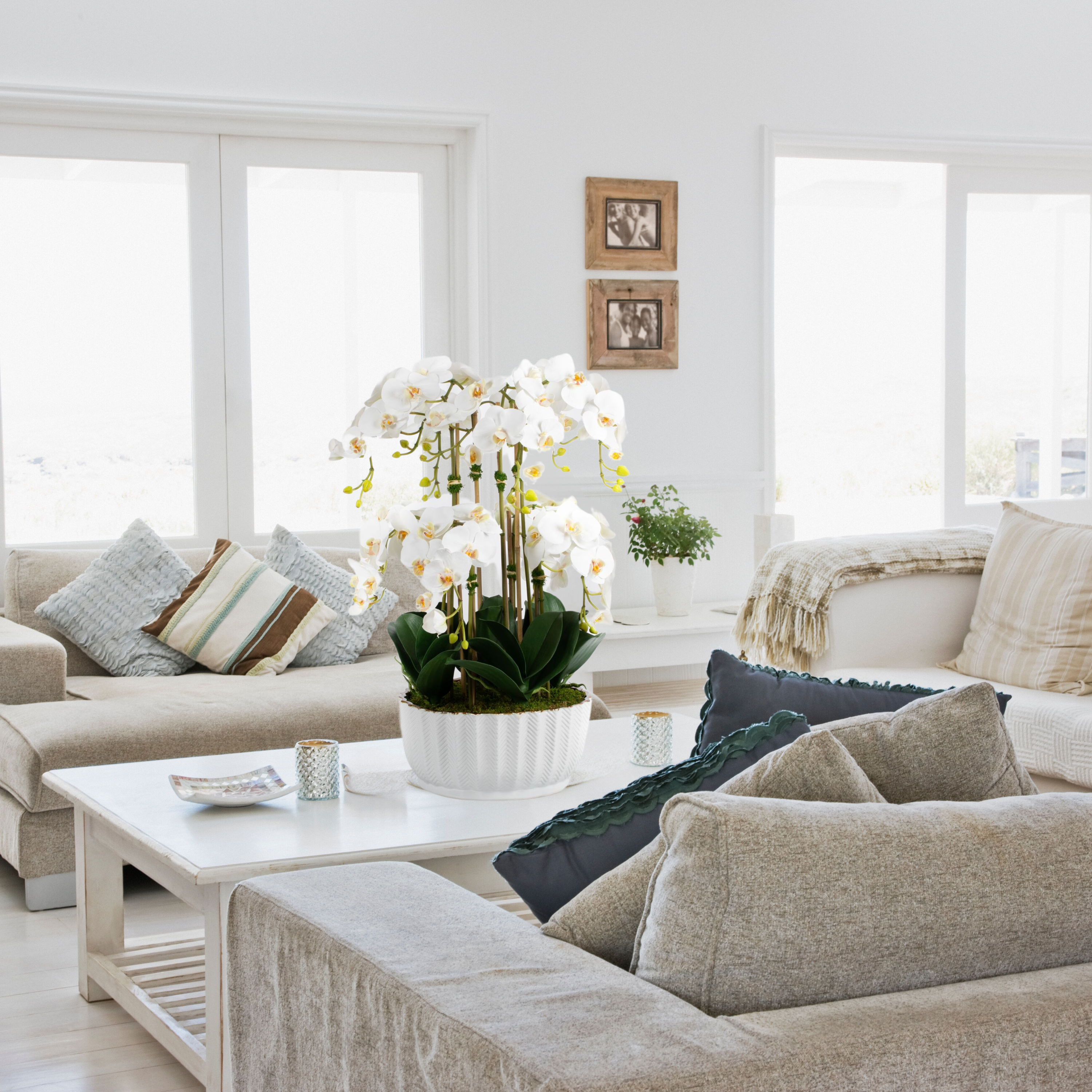 Faux orchid centerpiece in white vase