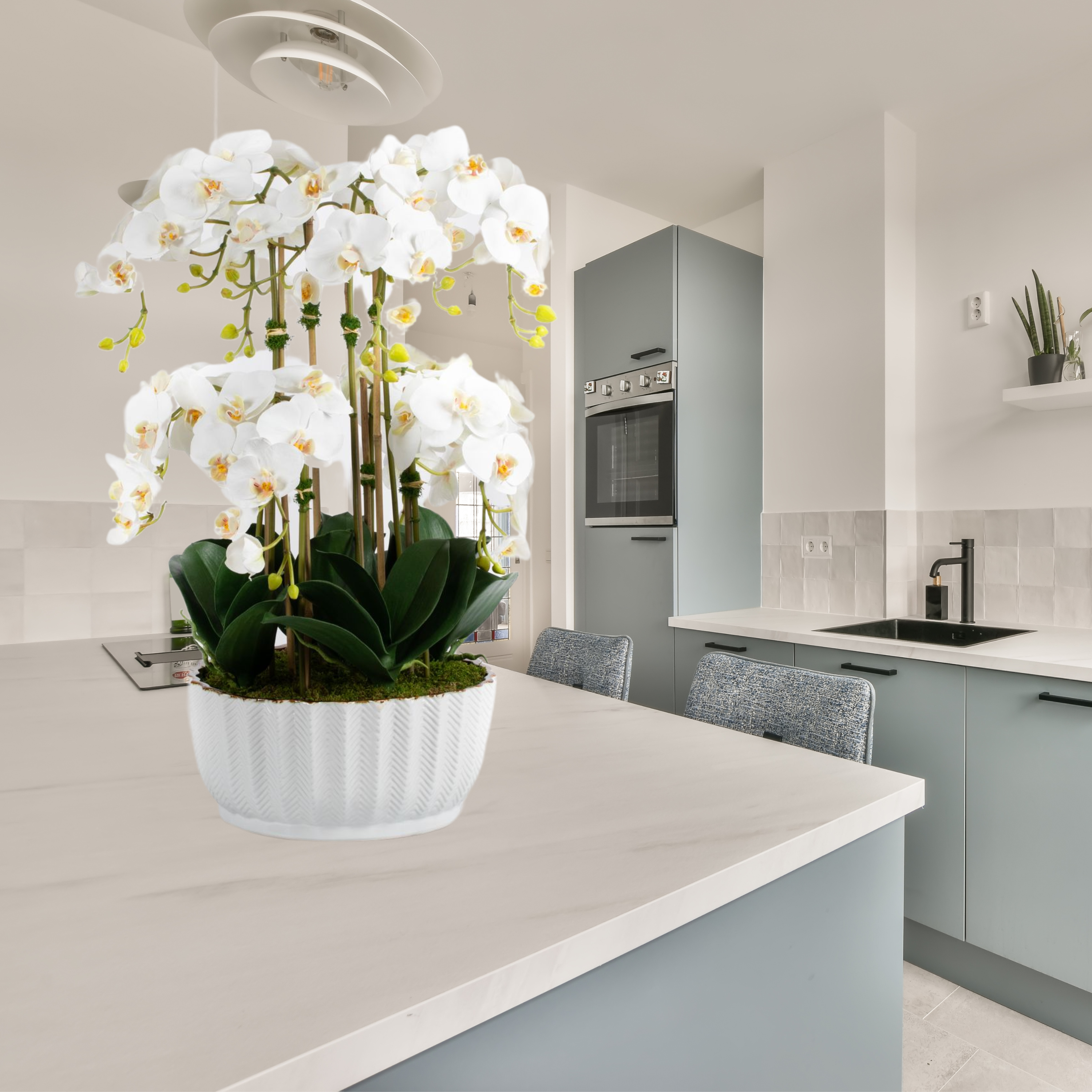 Faux orchid centerpiece in white vase